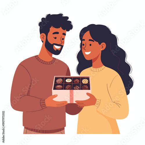 Man and woman exchanging a box of chocolates with smiles on their faces in a friendly gesture