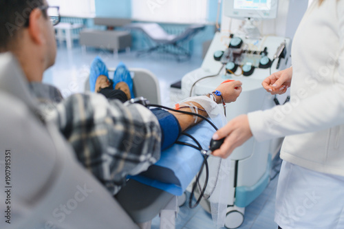 Cuadro en lienzo Person donating blood in apheresis procedure