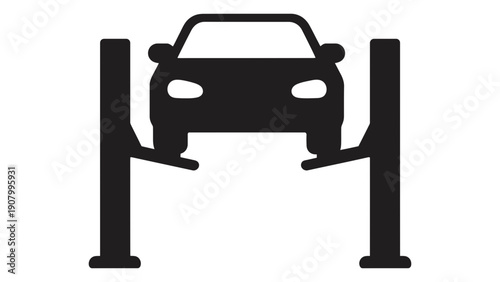 A car is lifted on a repair shop lift for maintenance.