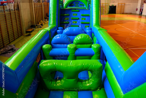 Colorful inflatable attractions providing fun and entertainment for children and adults at outdoor events.