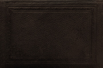 Vintage book cover. Dark leather texture with embossed rectangular frame and subtle grain detail. Natural mockup, background with copy space