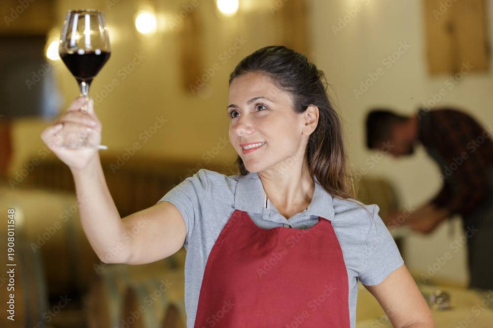 © auremar - photo of young successful female tasting wine