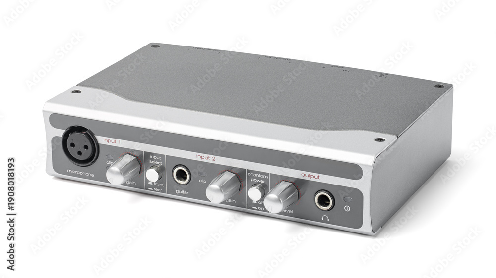 Fototapeta premium Professional external USB audio interface for home studio recording and music production, featuring XLR and guitar inputs with silver metal housing isolated on white background. 