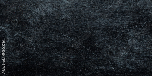 black and dark gray textured background featuring heavy distressing backdrop, empty, acrylic painted full frame background texture for web banner designs.