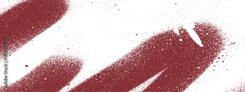 Abstract red spray paint strokes on a white background.