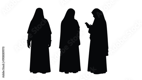 Three silhouetted figures fully cloaked with one looking at a mobile phone stand together