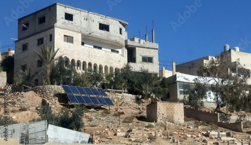 Solar panels for generating electricity are located in an old cemetery on the outskirts of the capital, Amman.