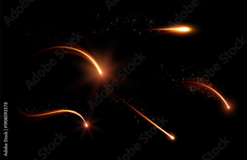 A set of abstract glowing falling golden lights with bright flashes and shimmering particles.