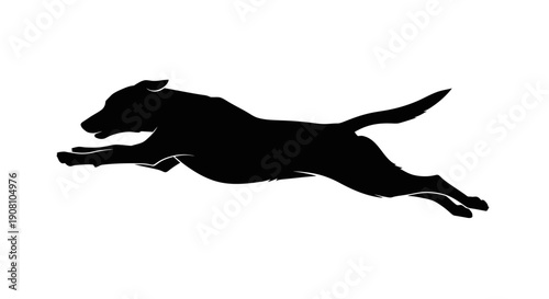 Black silhouette of a dog in mid air jumping isolated on white background