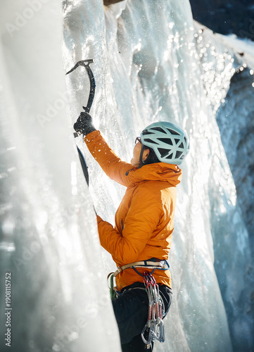 Portrait of Ice climber woman climb frozen glacier wall