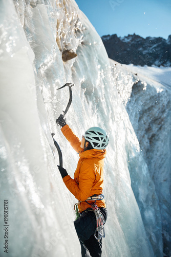 Portrait of Ice climber woman climb frozen glacier wall