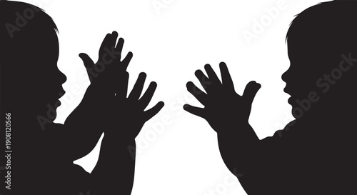Silhouettes of two people high-fiving each other in darkness