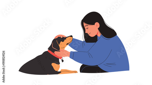 Gentle young woman sitting on the ground and lovingly petting her pet dog showing a strong bond of friendship and companionship.