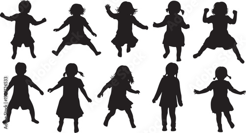 Silhouettes of happy children dancing and playing together freely