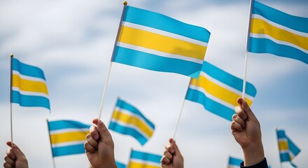 People waving flags with blue yellow and white horizontal stripes