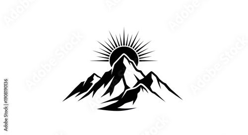 Mountain range silhouette with rising sun