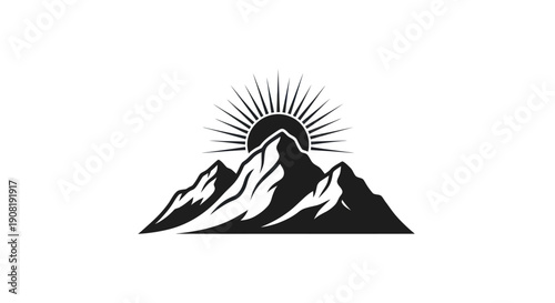 Mountain range silhouette with rising sun