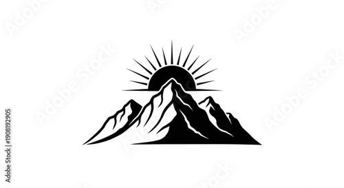 Mountain range silhouette with rising sun