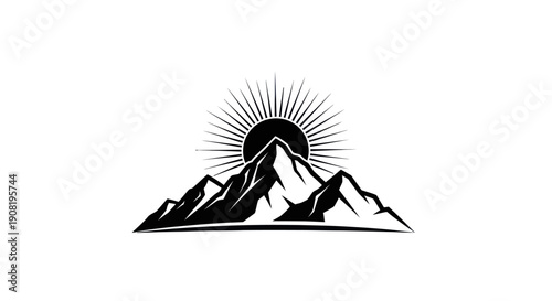 Mountain range silhouette with rising sun