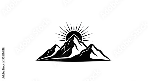 Mountain range silhouette with rising sun