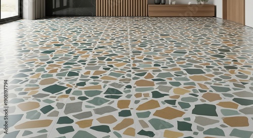 A mosaic tile floor with various colored stones in a modern interior setting, viewed from a low angle.