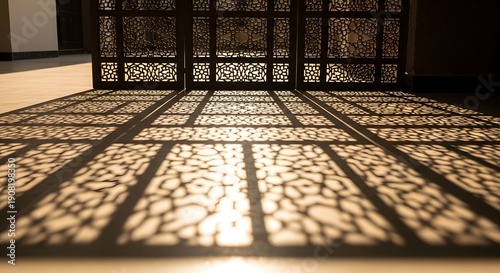Intricate patterns cast by latticework on a floor, sunlight streaming through, creating complex shadows in an architectural interior space viewed from below.