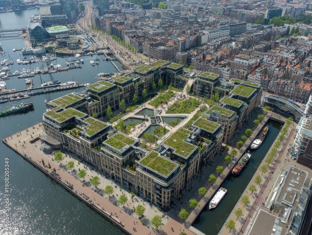 Obraz premium Aerial view showcases a modern complex with green roofs, a central courtyard, and surrounding waterways