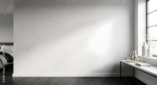 Minimalist white bedroom wall with natural light and window.