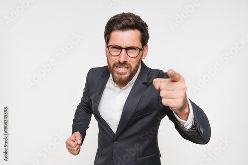 Foto Studio, angry and portrait of business man in suit, pointing and accountability for you, shouting and reprimanding