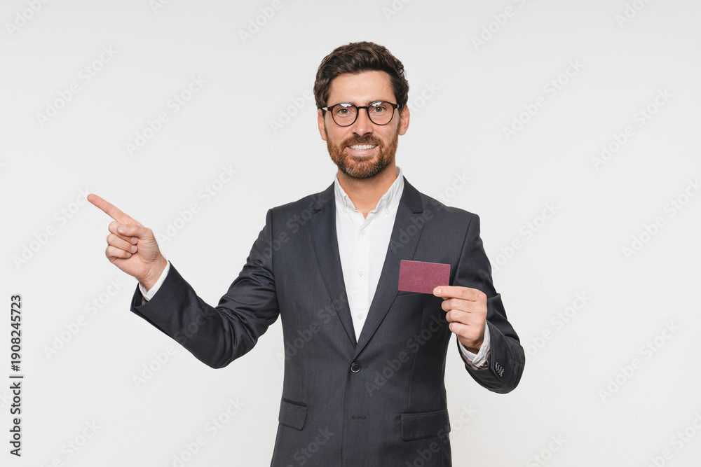 © InsideCreativeHouse - Hand, pointing and businessman with credit card for finance, bank and money payment isolated. Portrait of happy corporate employee able to buy or pay bills, retail shopping or debt with salary