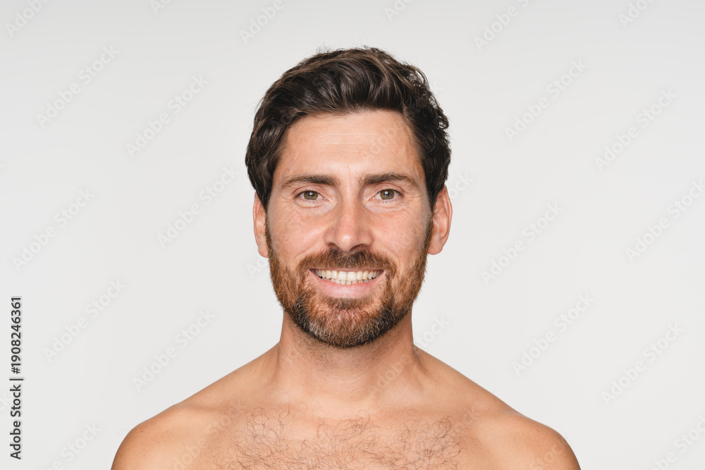 Fototapeta premium Shampoo, cosmetics and aesthetic with person on background for texture and spa treatment. Beauty, face and self care with portrait of man in studio for cleaning, salon grooming and hairstyle.