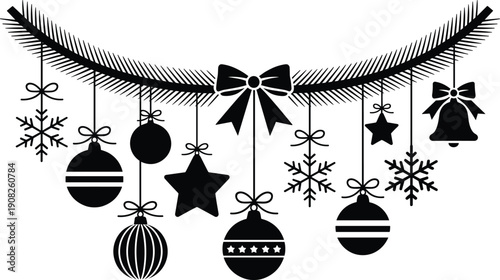 Black and white Christmas ornaments hanging on a branch with bows and snowflakes