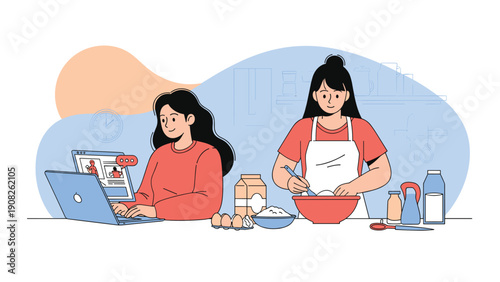 Two young women multi-tasking by working on a laptop and baking in the kitchen representing a busy modern domestic lifestyle at home.
