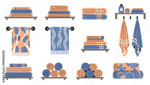 Neat collection of folded and rolled towels in various patterns and colors arranged on wooden shelves with bathroom items.