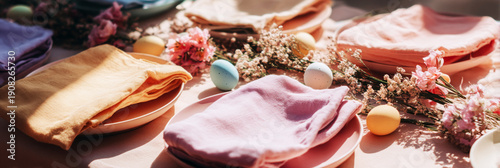 Bright Easter table setting includes white plates with colorful eggs and a simple floral centerpiece. The table is ready for a festive meal with family and friends during Easter, banner
