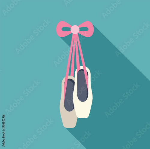 Ballet pointe shoes hanging from a pink ribbon, casting long shadows