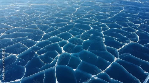 Wallpaper Mural Abstract pattern of deep blue ice cracks on a frozen lake surface, creating a natural mosaic. Torontodigital.ca