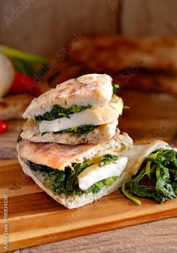 Neapolitan panuozzo sandwich with friarielli and provola cheese