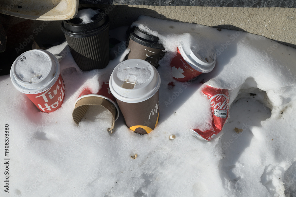 Fototapeta premium discarded beverage cups in the snow, Toronto