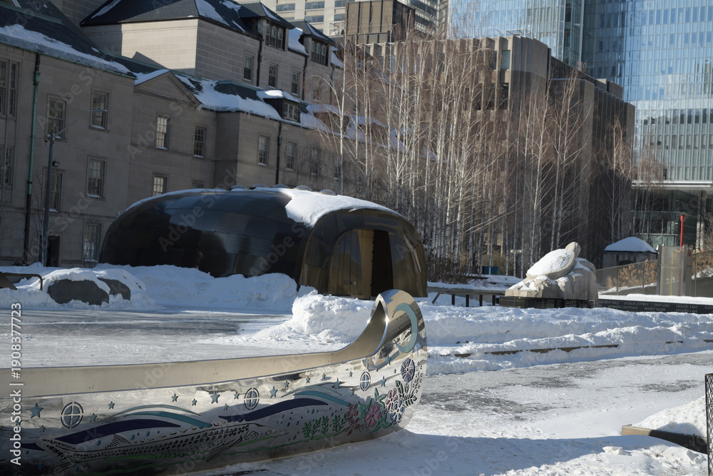 Fototapeta premium wide view of Spirit Garden inclu Spirit Canoe by Tannis Nielsen at at Nathan Phillips Square, City Hall, Toronto