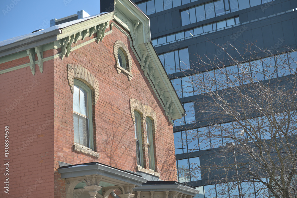 Fototapeta premium detail of heritage property at 207 McCaul Street (known as the Richard Purdom House), contrast with modern building, Toronto