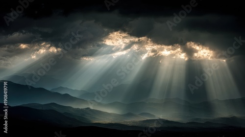Wallpaper Mural Sunlight beams piercing dark clouds over mountains. Dramatic light rays breaking through storm sky. Hope and spiritual concept. Torontodigital.ca