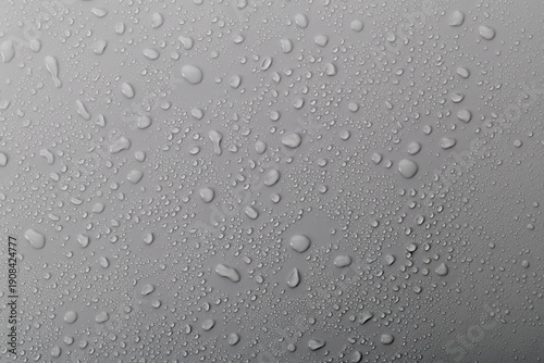 Wallpaper Mural Close up view of water droplets on a gray surface during a rainy day showing textures and patterns formed by the water Torontodigital.ca