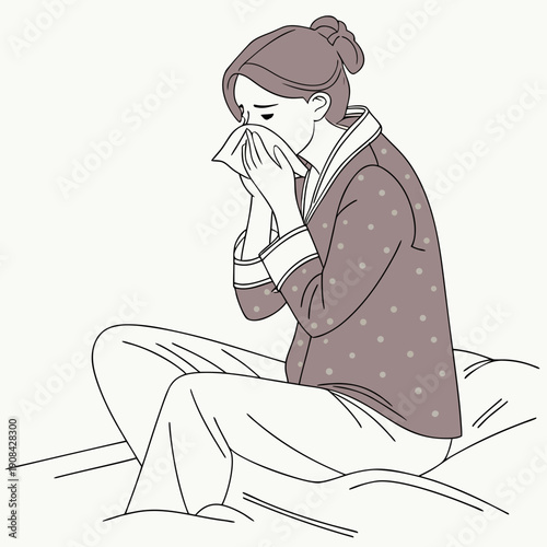 Woman in pajamas sneezing while sitting on bed with tissue