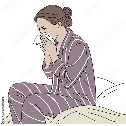 Woman in purple striped pajamas sneezing into tissue sitting on bed