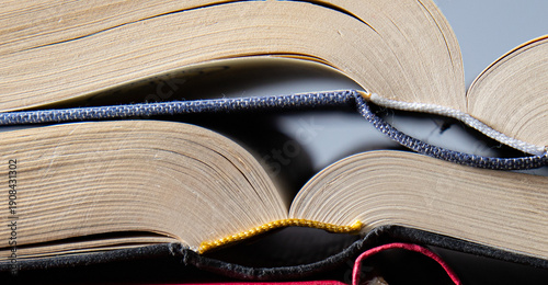 old books are laying on a table