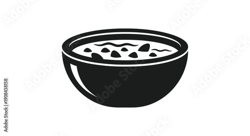 A black and white illustration depicts a rounded bowl filled with a liquid substance and scattered dark shapes