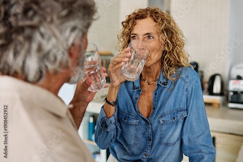 Photos Portrait of a happy active senior couple dating and flirting in a restaurant, or