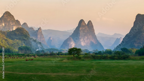 Guilin Karst Mountains with Grazing Livestock in Misty Valley