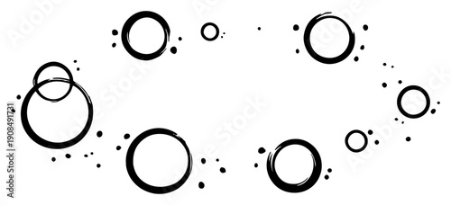 Abstract composition of hand drawn ink circles and splatters in minimalist sketchy style